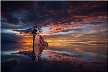 Seasonal Tour: Sunrise  with reflections in the water, Uyuni Salt Flats