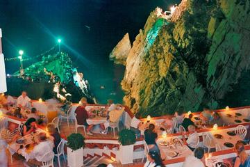 High Cliff Divers Show of La Quebrada at La Perla Restaurant