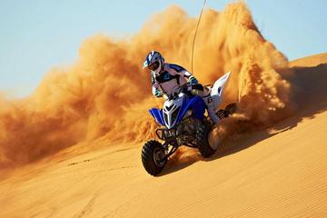 Dubai 30-Minute Desert Quad Bike Ride with Camel Ride, Sand Boarding, and BBQ Dinner