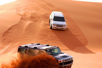 Dubai Red Dune Bash and BBQ Dinner, with Camel Ride, Sand Boarding, and Shows