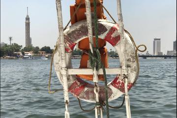 Sailing Egyptian felucca ride on the Nile at sunset in Giza