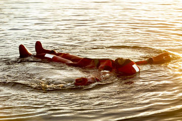 Midnight sun floating in a Lake in Rovaniemi