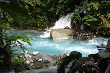 Blue Volcanic River Waterfalls and Hot Springs Mud Bath Adventure in Rincon de la Vieja from Playa Flamingo